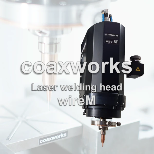 coaxworks | Laser welding head wireM (also coaxwire, shown with transparent background) | Processing head, welding component, laser optics, accessory or equipment for laser processing machines, processing centres, machining centers, robots or CNC systems, metal printers, printer coaxial for carrying out clean, resource-friendly, direction-independent laser wire deposition welding, wire laser metal deposition (wire-LMD), surface coating, cladding, hard surfacing, additive manufacturing or welding with filler metal